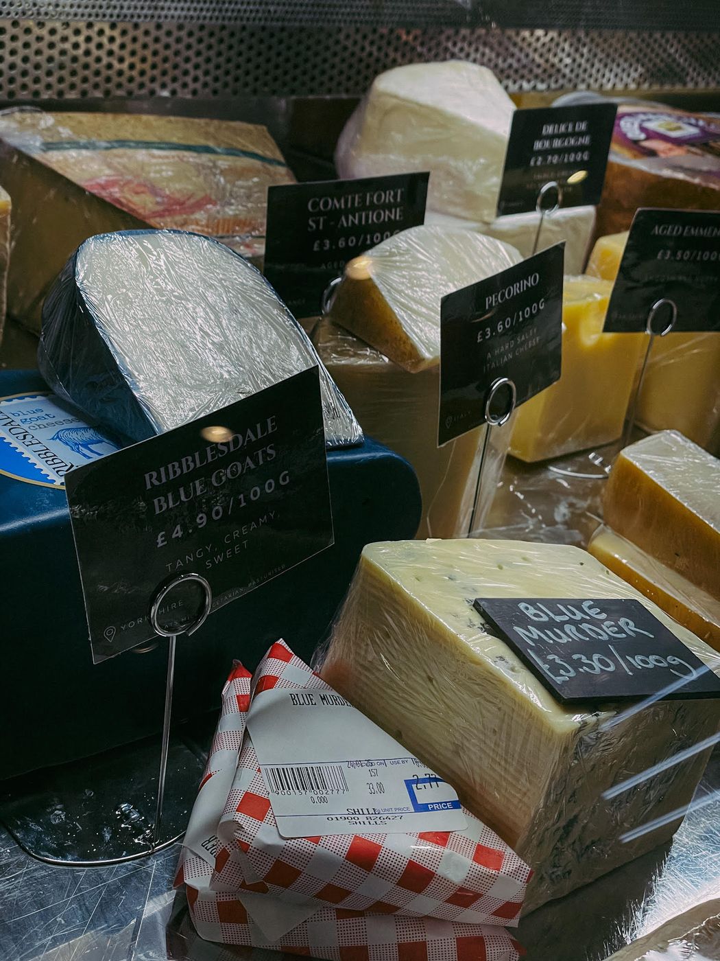 The cheese counter at Shill's, cut to order with handwritten price cards